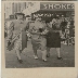 photograph of three women walking outside a busy street corner